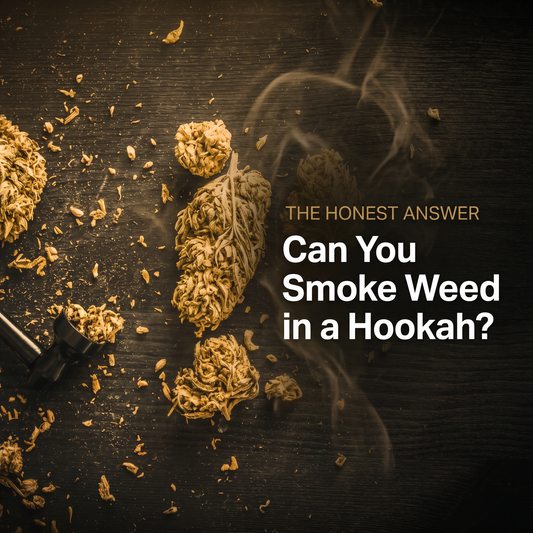 Cannabis buds and a pipe on dark wood with a warm golden wash — can you smoke weed in a hookah?