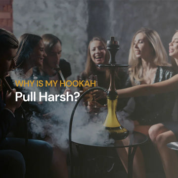 Group of friends smoking a yellow hookah together in a dark lounge